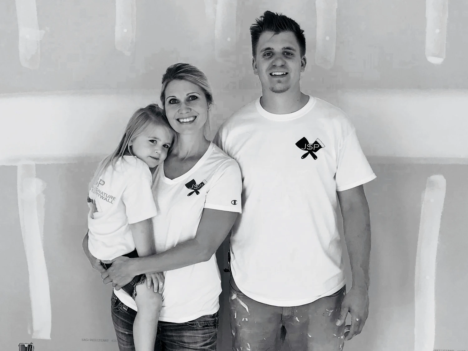 Daine with his family wearing JSP Drywall shirts