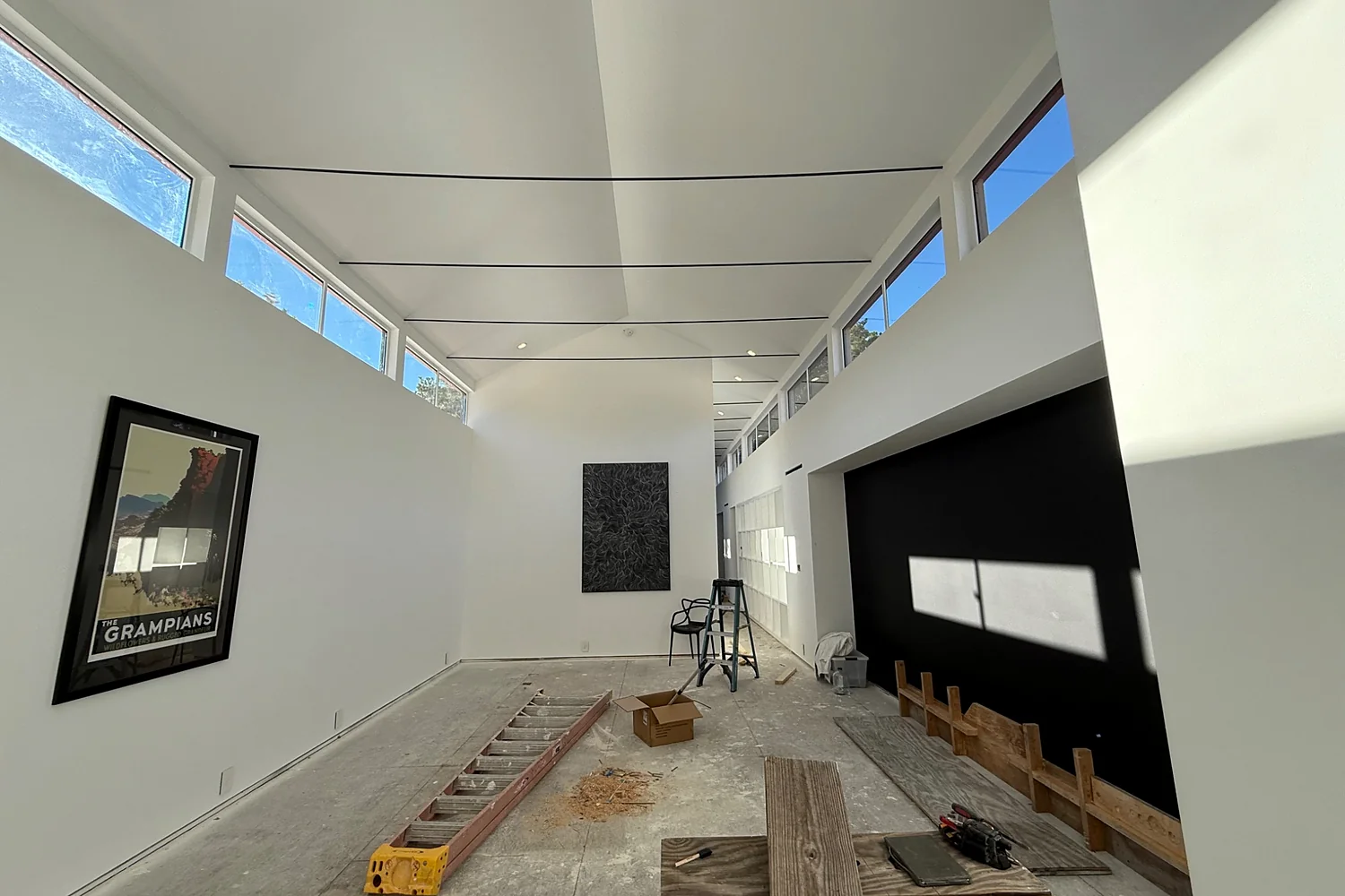 Large modern residential interior undergoing renovation and finishing