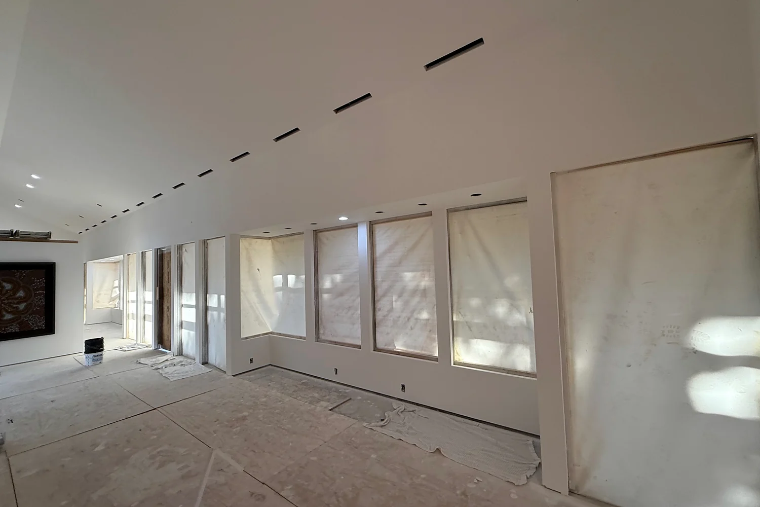 Large modern residential renovation with finished walls and ceiling